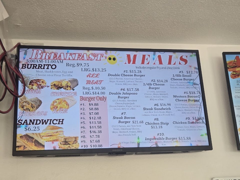 Counter menu showing burgers, dogs, and sides.
